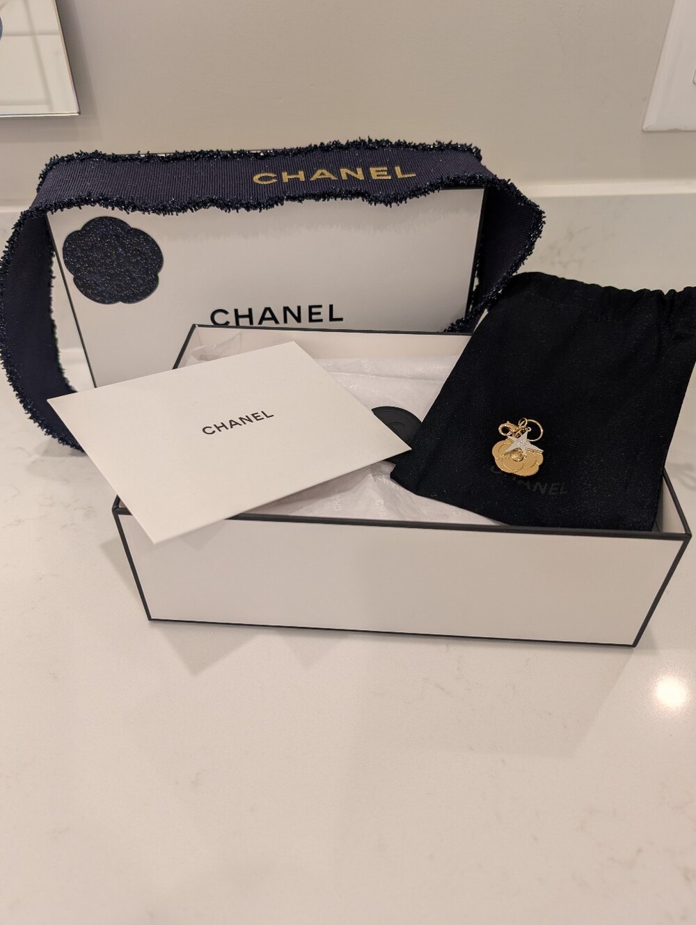 CHANEL White Gift Box W/ Blue Ribbon And Gold Tone Camellia Flower Branded Charm